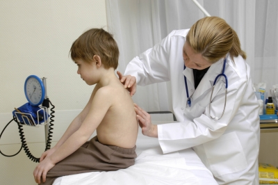 doctor examining child for Spinal Stenosis
